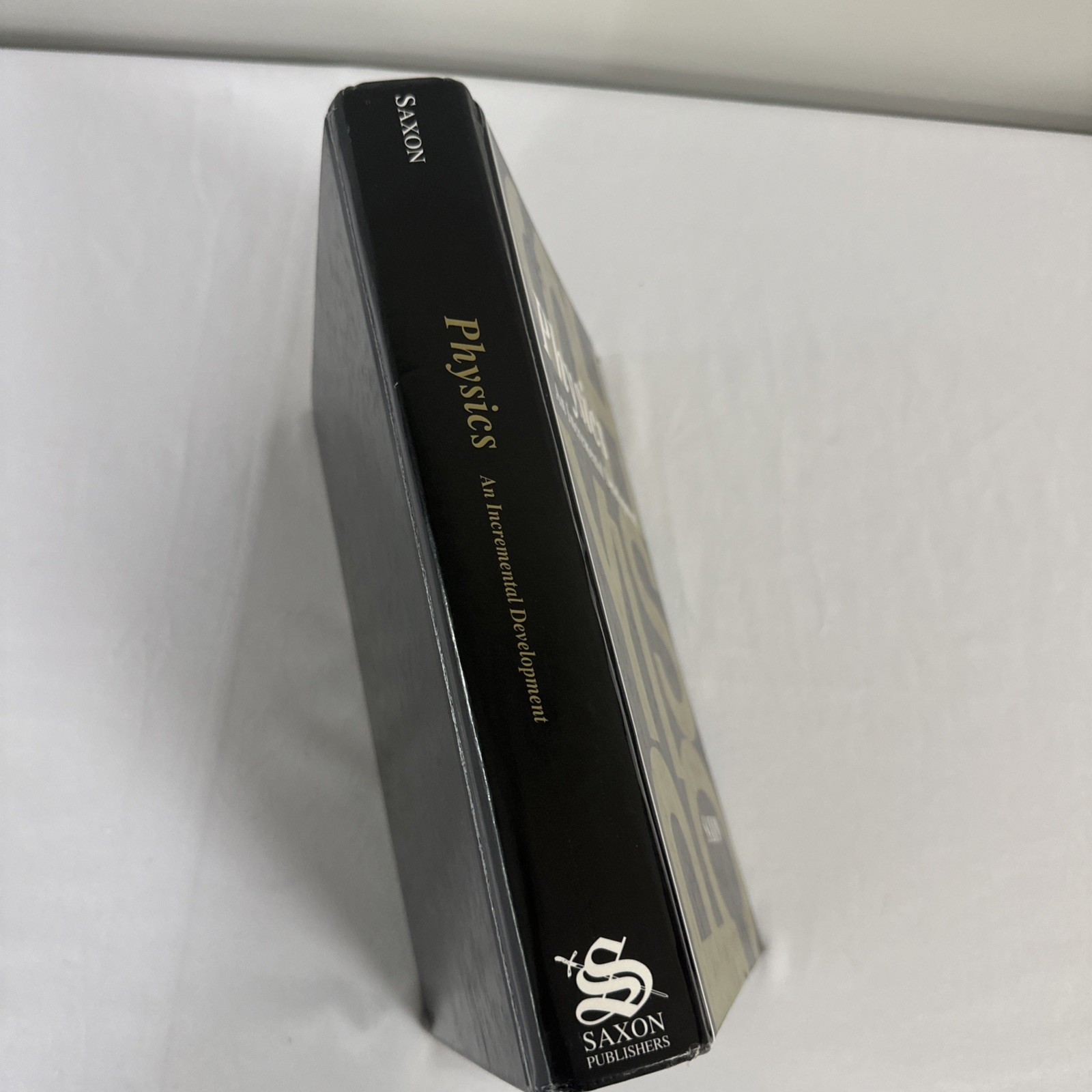 Physics :An Incremental Development Textbook & Solution Manual by John H. Saxon