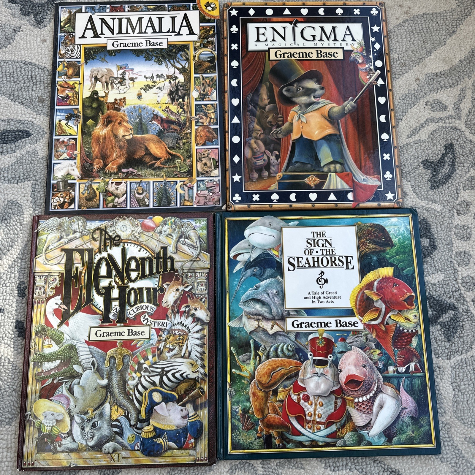Lot of 4 Graeme Base Books Animalia Enigma Seahorse Eleventh Hour