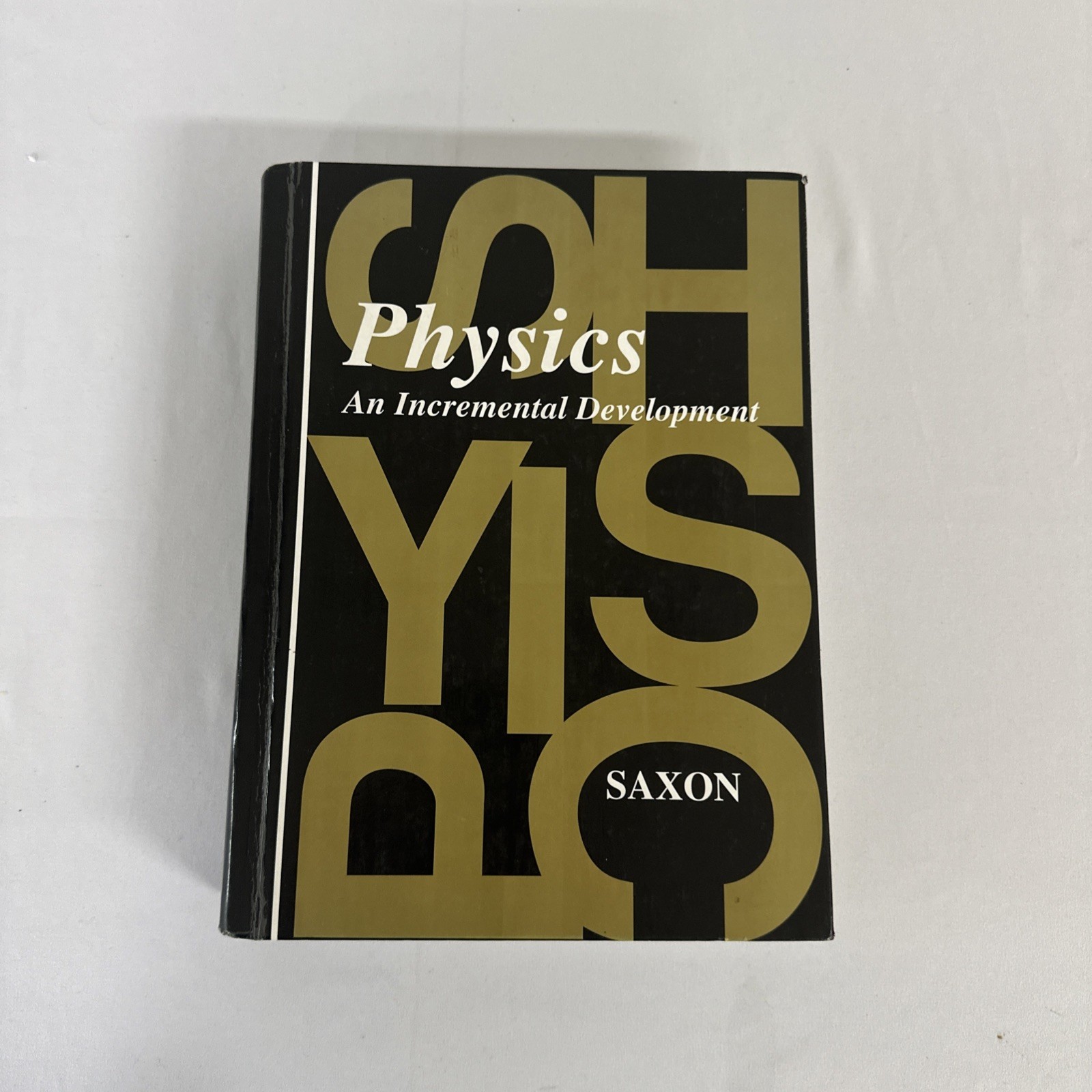 Physics :An Incremental Development Textbook & Solution Manual by John H. Saxon