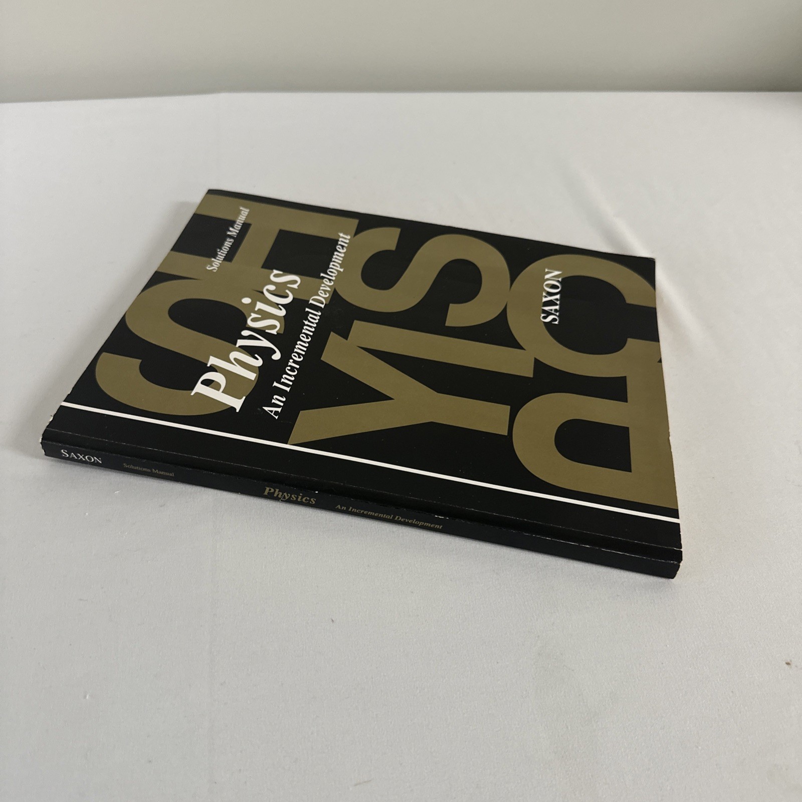 Physics :An Incremental Development Textbook & Solution Manual by John H. Saxon